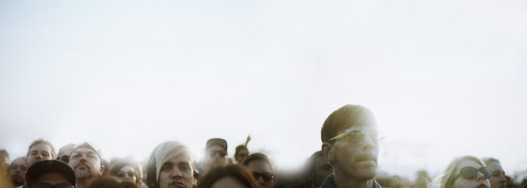 person feeling left out in crowd